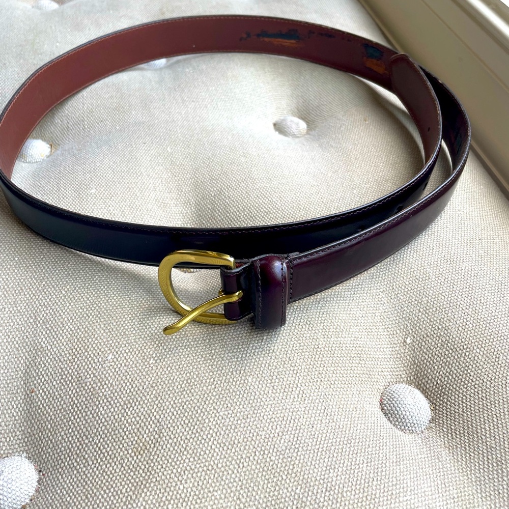 This is a brown leather belt with brass buckle. Coach label. size 36. Style 3921